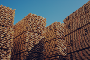 Stacks of lumber in an outdoor yard environment where WiFi coverage is needed for inventory systems and scanners